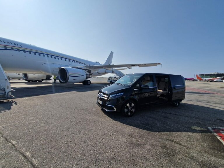 Nice Cab 06 private driver on the Nice airport tarmac next to a private jet